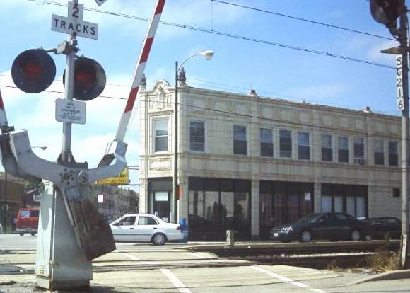 75TH AND EXCHANGE AVE - THE SITE OF FLANDER'S TEA ROOM IN THE 1950s - I. C. TRAIN CROSSING FOREGROUND - FROM 79TH STREET OVERFLOW SITE