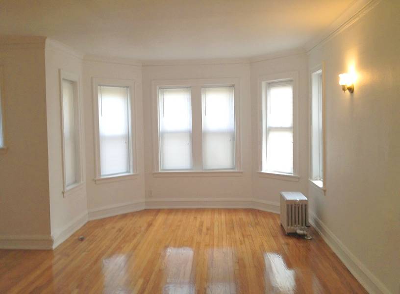 PHOTO - CHICAGO - 1748 E 71ST - LIVING ROOM - EXAMPLE OF A FIXED-UP APRTMENT LOOKING MUCH AS IT DID - EDITED FROM REAL ESTATE IMAGE